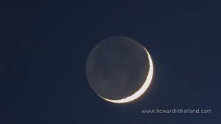 Time lapse of a new moon at twilight with earthshine