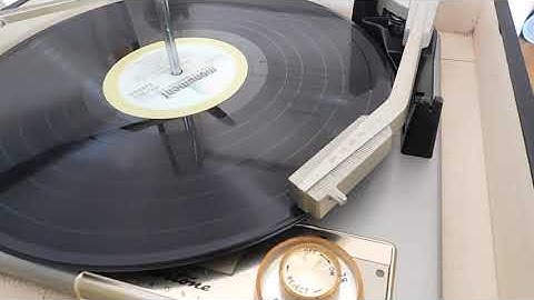 Silvertone STEREO record player playing a couple LP, 33.3 RPM records.