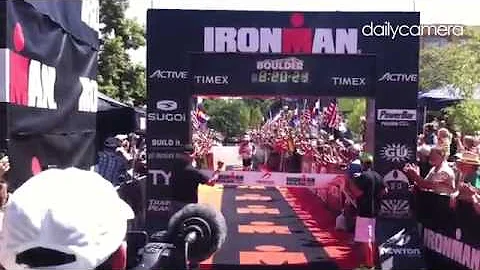 Boulder's Justin Daerr crosses the line to win the...
