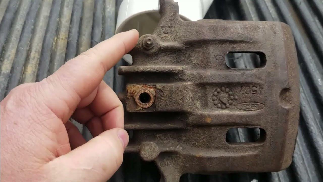 Soft spongy brakes after replacing a brake caliper? Is it upside down