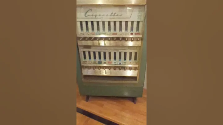 IN GOD with 1950's Vintage Cigarette vending machine at Duke Homestead Museum Durham North Carolina