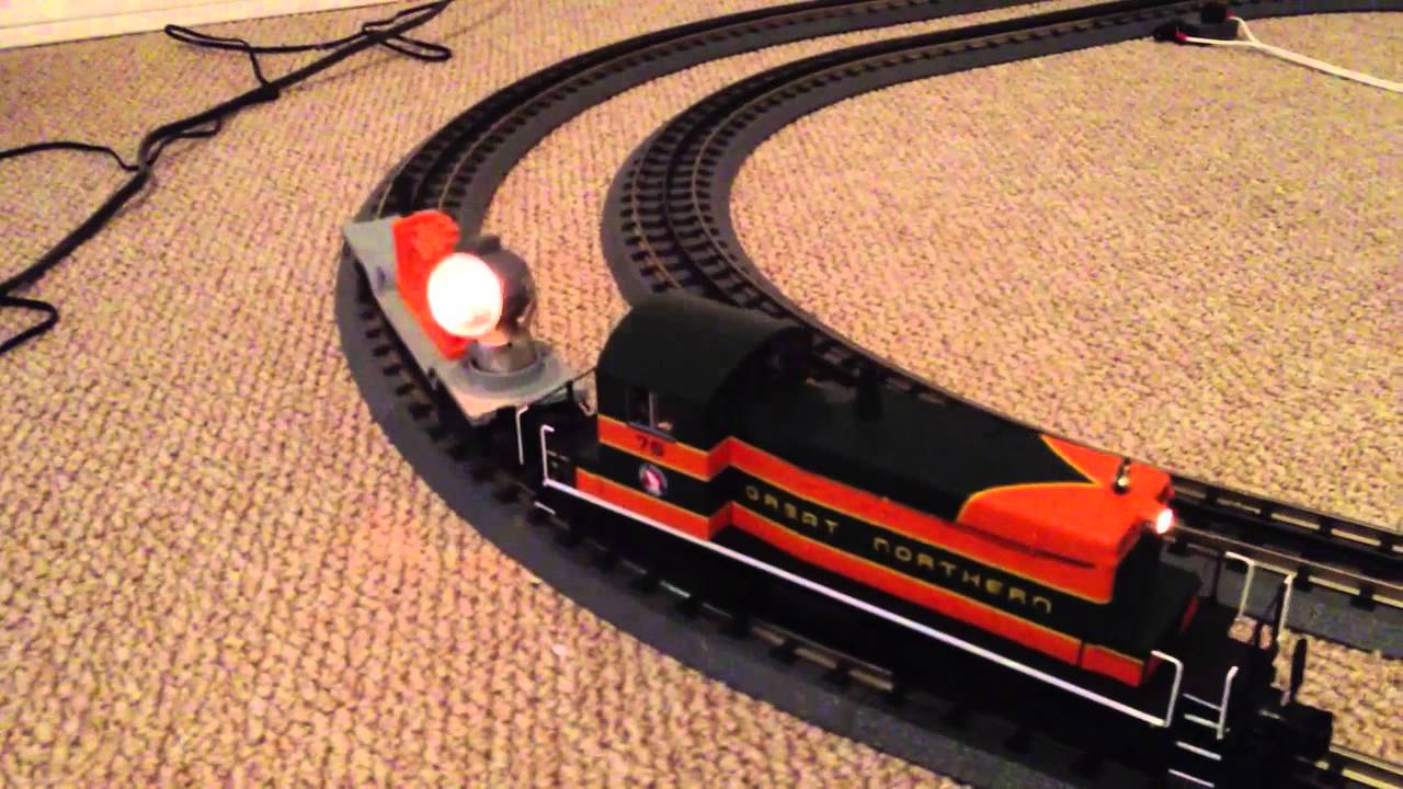 MTH SW-1500 pulling a post war illuminated searchlight car.