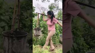 Carrying Water To Water Vegetables