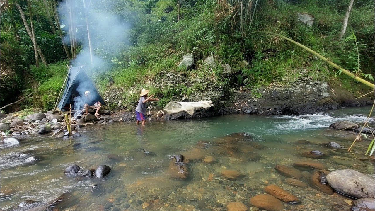 Building a shelter in a valley near the up stream river ,camping & having a relaxing picnic