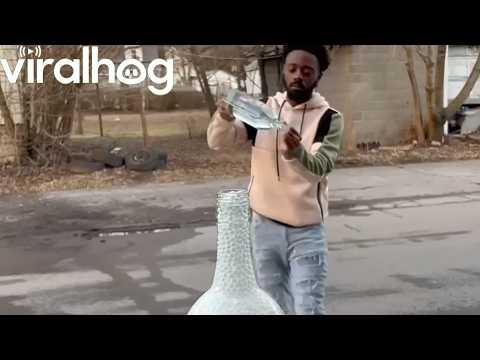 Beads Flow Perfectly Through Glass Bottles || ViralHog