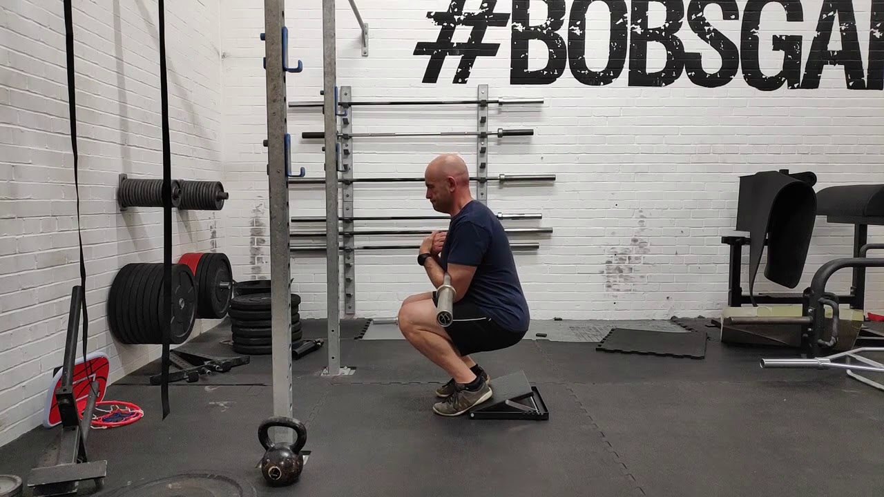 Heels Elevated Zercher Squat - YouTube