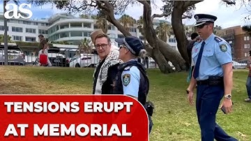 Man wearing Keffiyeh REMOVED from BONDI BEACH MEMORIAL after Hanukkah shooting