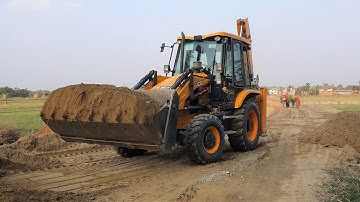JCB Backhoe Machine installing Culvert Pipe in Drain and Felling Soil - JCB Road Construction Video