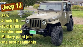 Jeep TJ 33" tires 15x10 rims, 4 inch lift kit, military paint job, fender mod.