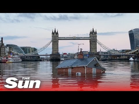 Extinction Rebellion protesters float ‘sinking house’ down the river Thames