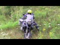 Adventure motorcycle stopped on a steep uphill