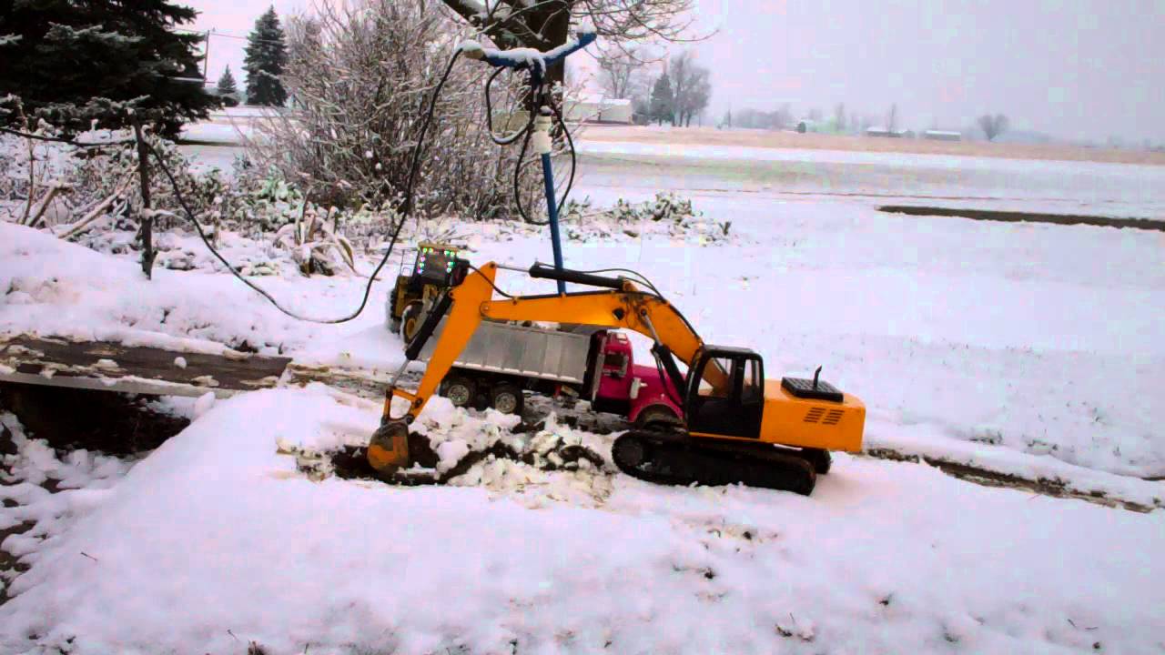 excavator digging in the snow YouTube