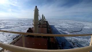 Timelapse Giant ship stuck in ice at Duluth , breaking the ice and passing great lakes.