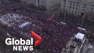 Trump’s Marine One helicopter performs flyover of supporters gathered in Washington DC