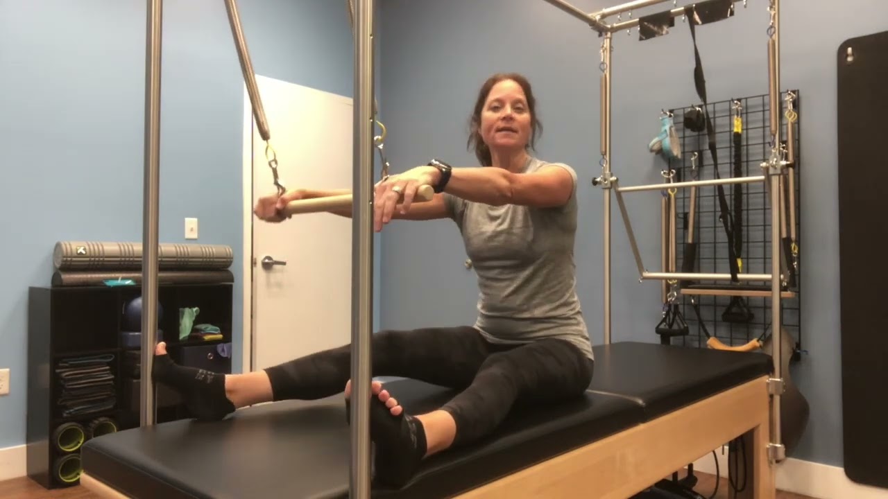 Neck Pull with roll down bar on springboard/Cadillac