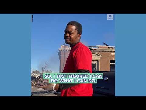 Man gives out food after deadly tornadoes in Kentucky town.