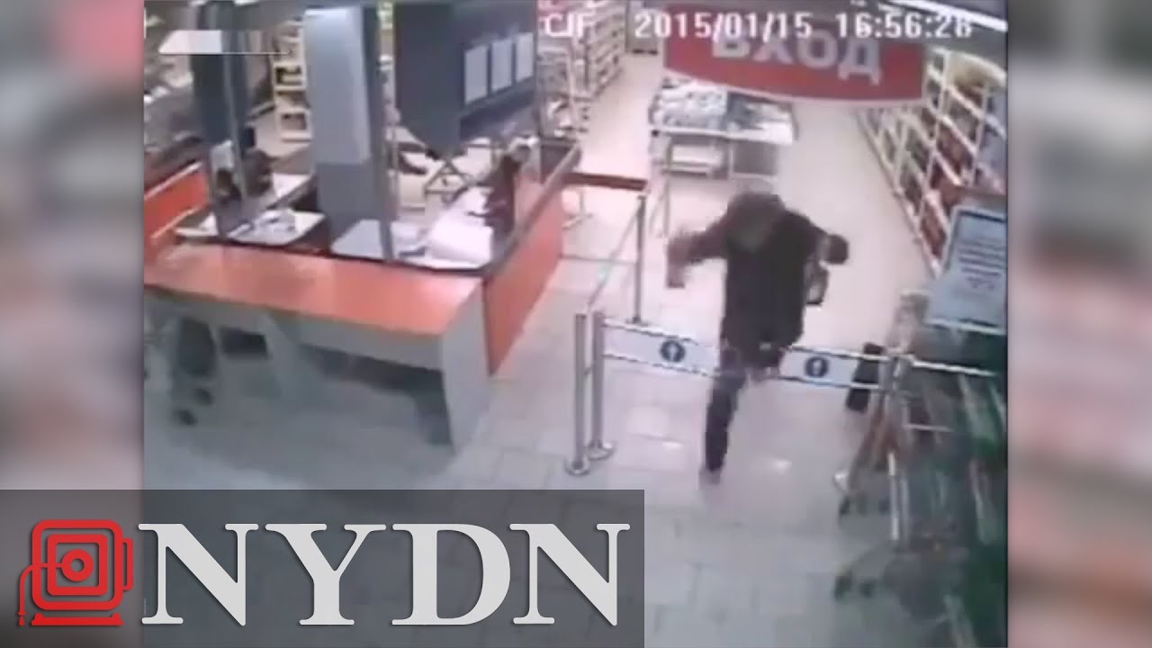 Wannabe thief runs into Russian store's entrance barrier, tumbles to