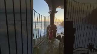 Giant Wave Soaks Woman Posing By Ocean