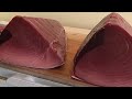 Cutting giant bluefin tuna to luxurious sashimi