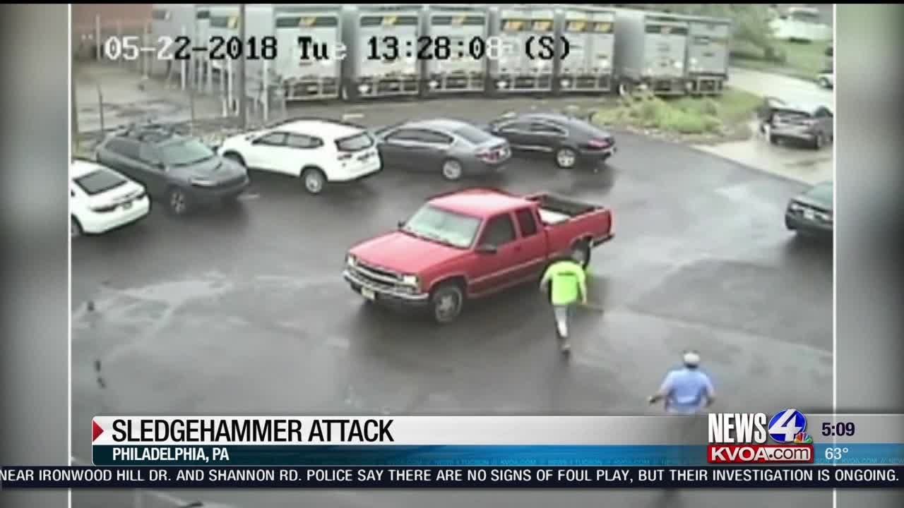 Man attacks SUV with sledgehammer YouTube