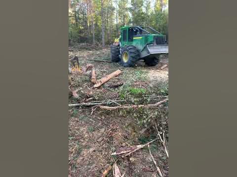 John Deere skidder Bringing paper wood to Cat loader #loggers - YouTube