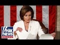 Nancy Pelosi tears up Trump's speech script behind him