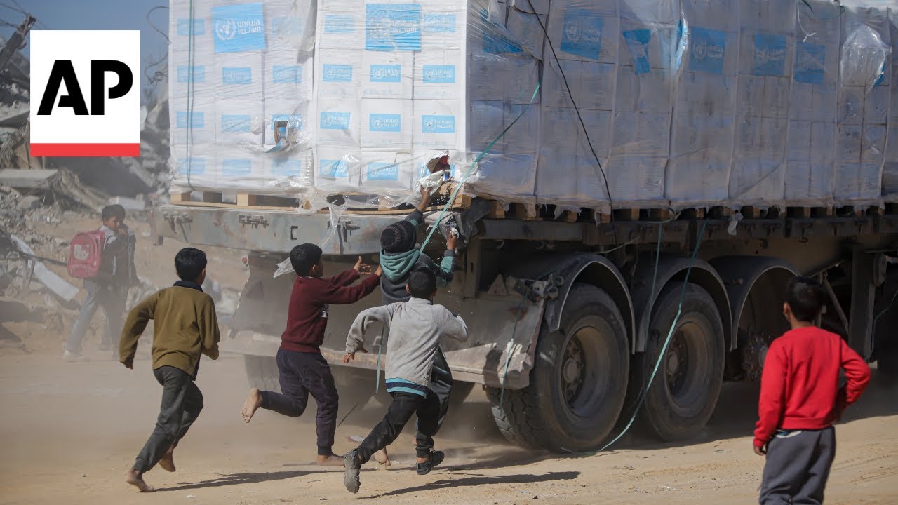 Palestinians in Gaza scramble for aid as trucks drive through Rafah