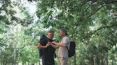 Hikers plan outdoors, Travelers coordinate canopy routes, Group strategizes paths beneath verdant