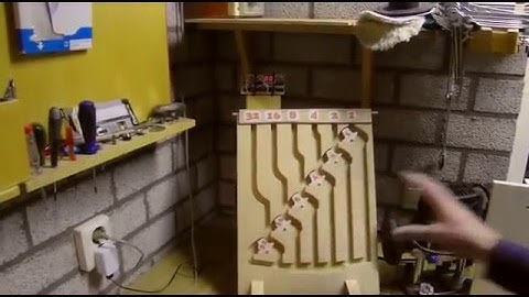 Marble adding machine connected to a display