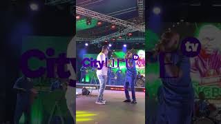 Pasuma and his backup singer having fun on stage