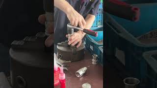 How the factory tightens the body of a flat-face quick coupler.