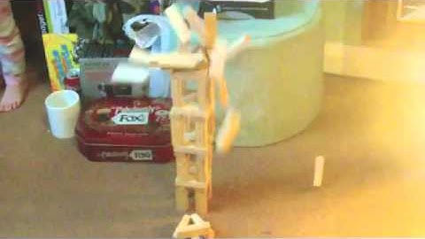 Jenga tower collapsing in slow motion, 3