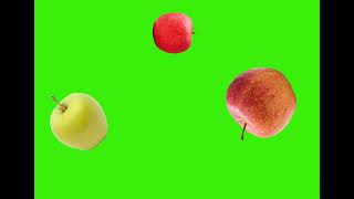 Apples falling and spinning in transparent space on green screen background