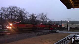 BNSF 7557, BNSF 7288 and BNSF 7219 lead NS 284 through a rainy Lindale, GA
