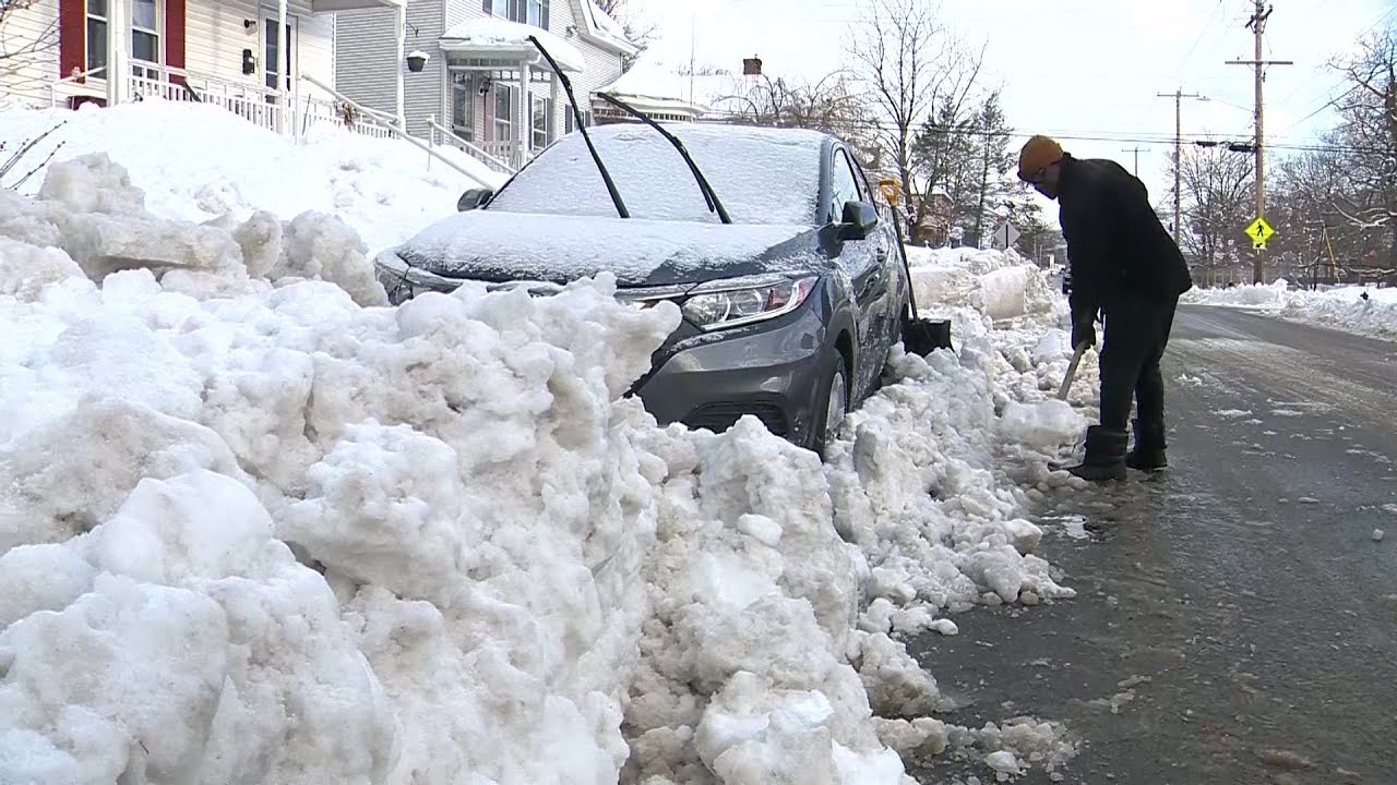 'I'm tired of it;' Fitchburg residents dig out from feet of snow - YouTube