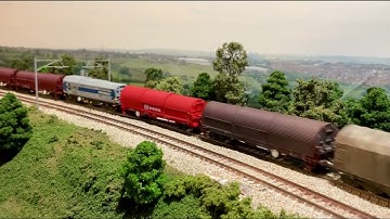 Schenker 60 hauling a failed 66 with a steel train