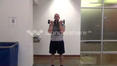standing rotational dumbbell press