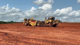 CAT 631G Scraper Being Pushed By Komatsu and CAT Dozers