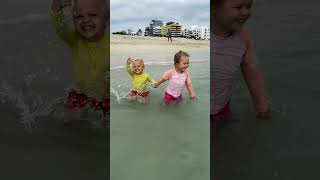 Funny Ocean Kids Swimming! Kids play in the water at the beach in Miami in late November