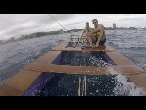 Sailing a Patí Català (Catalan Catamaran) in Palamós, Costa Brava.
