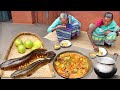 santali grand mothers cooking amazing SNAKE HEAD FISH curry with green tomato for their lunch