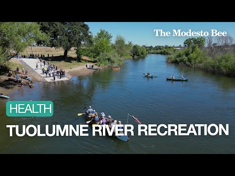 Watch Kayaks And Canoes Paddle Down Stream At The Tuolumne River Boat Launch