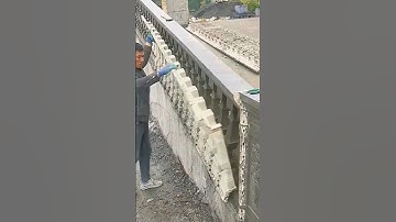 Construction workers remove plastic molds from cement decorative railings#High efficiency