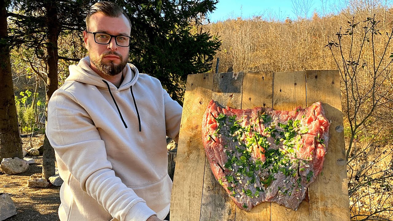 Nailed Carp baked on open fire, fish recipes. Zakovan šaran pečen na