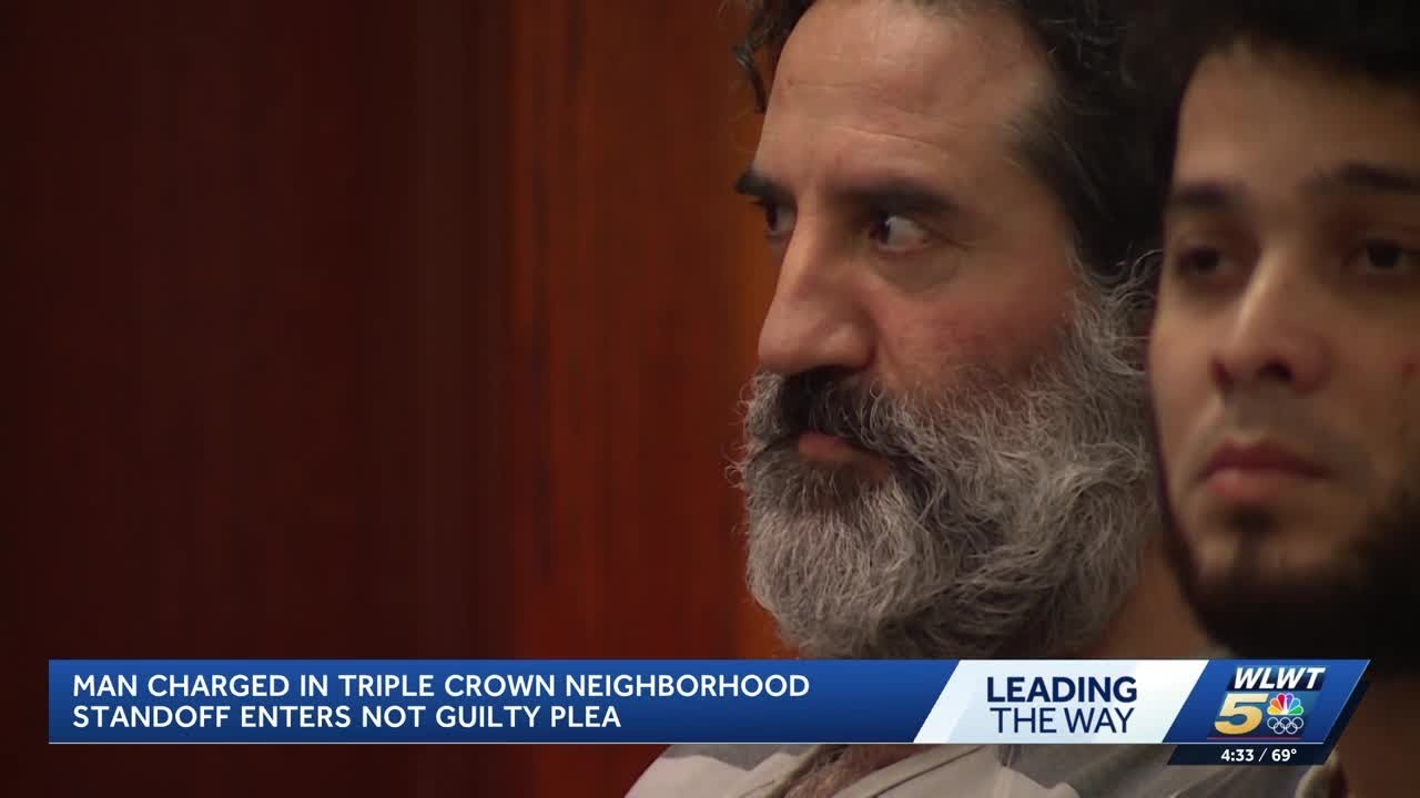Man accused of shooting at landscapers, officers during standoff makes ...