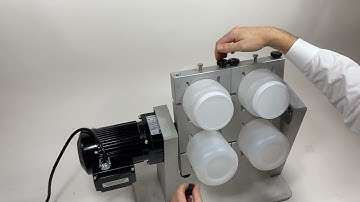 Loading the Analytical Testing TCLP rotary agitator.