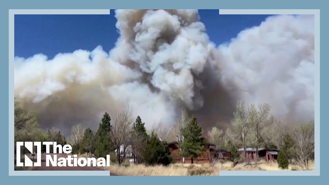 Arizona wildfire grows bigger causing thousands to flee