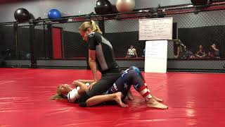 AJ Clingerman teaching a Women's Class how to use the Upa for Mount Escape in Jiu Jitsu