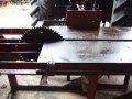 Pto driven sawbench with sliding table