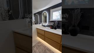 Ambient lighting details inside a modern en-suite 💡 LED vanity mirrors, & toe kick lighting